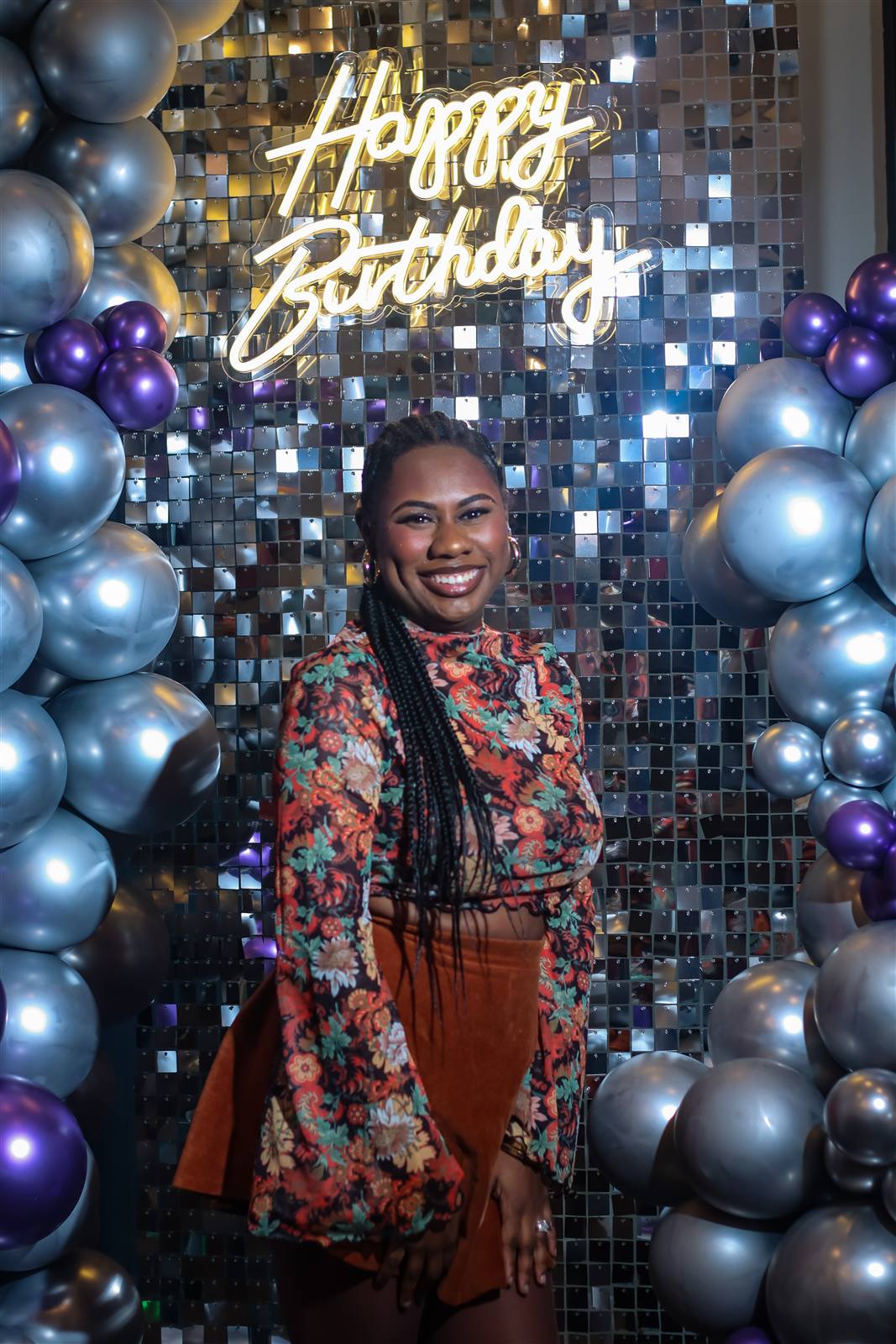 Portrait in front of an event backdrop