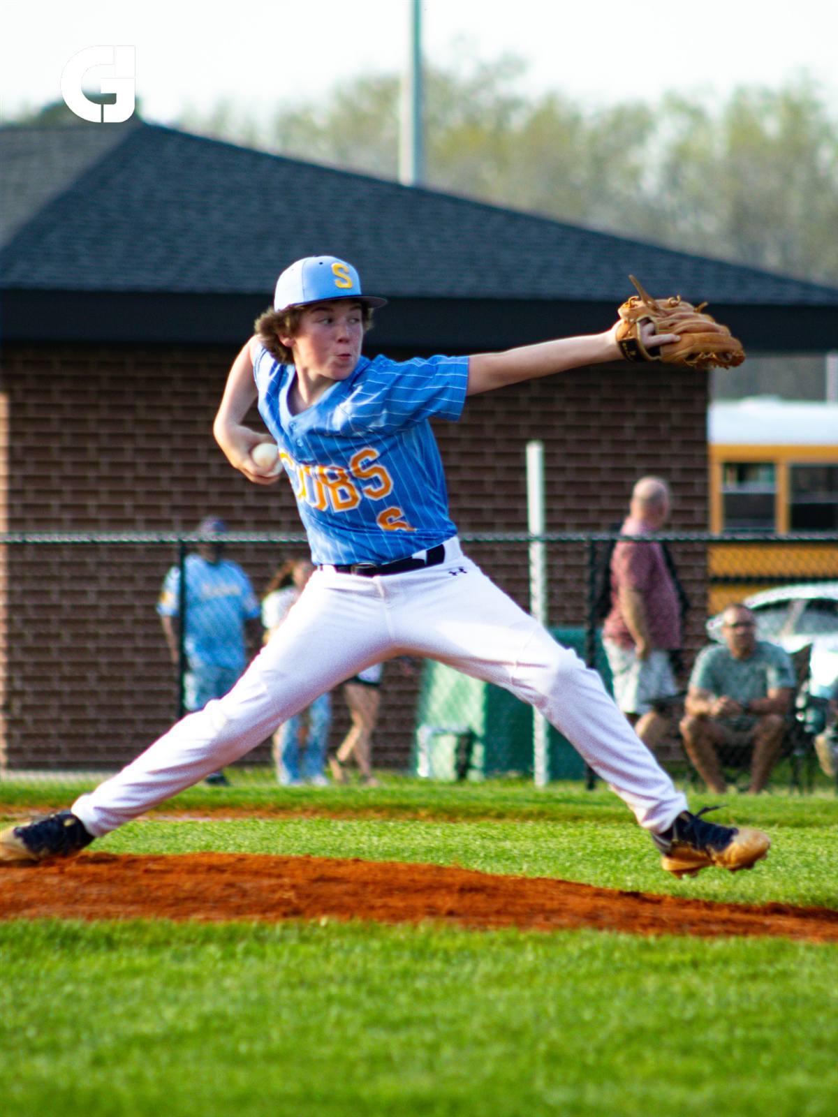 Baseball pitcher mid-throw